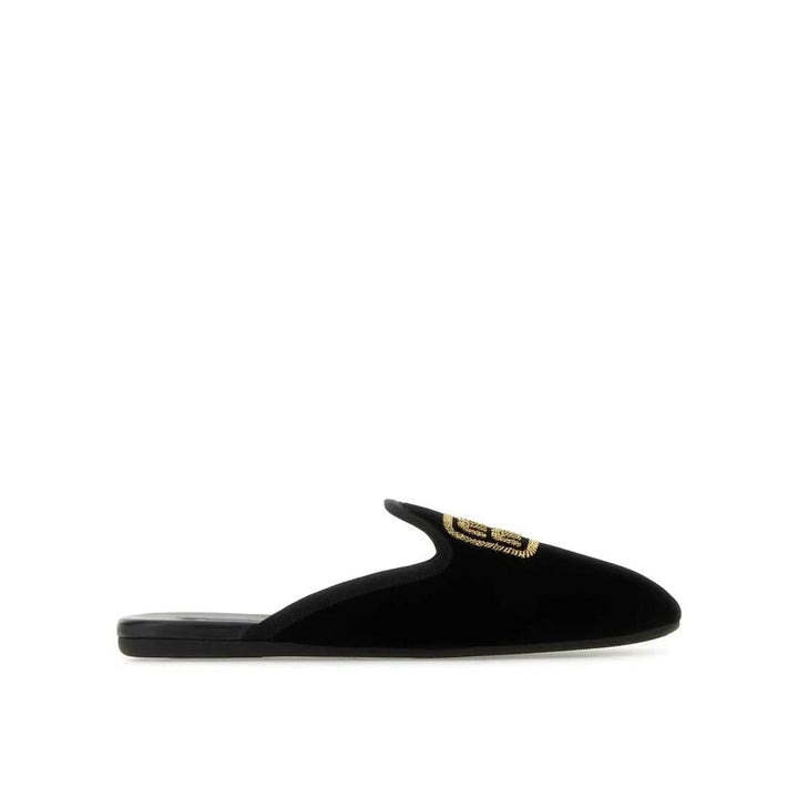 Mules Miu Miu de piel de becerro negras