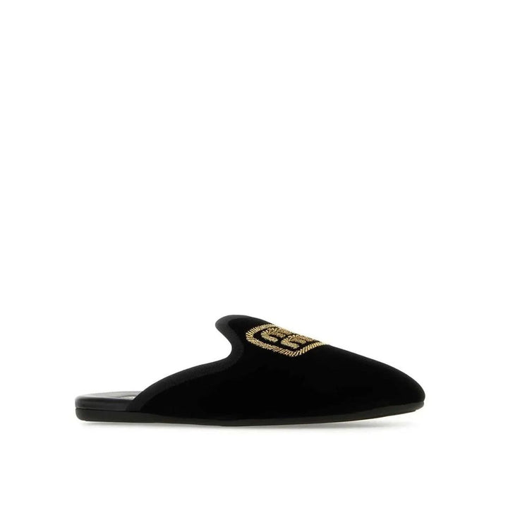 Mules Miu Miu de piel de becerro negras