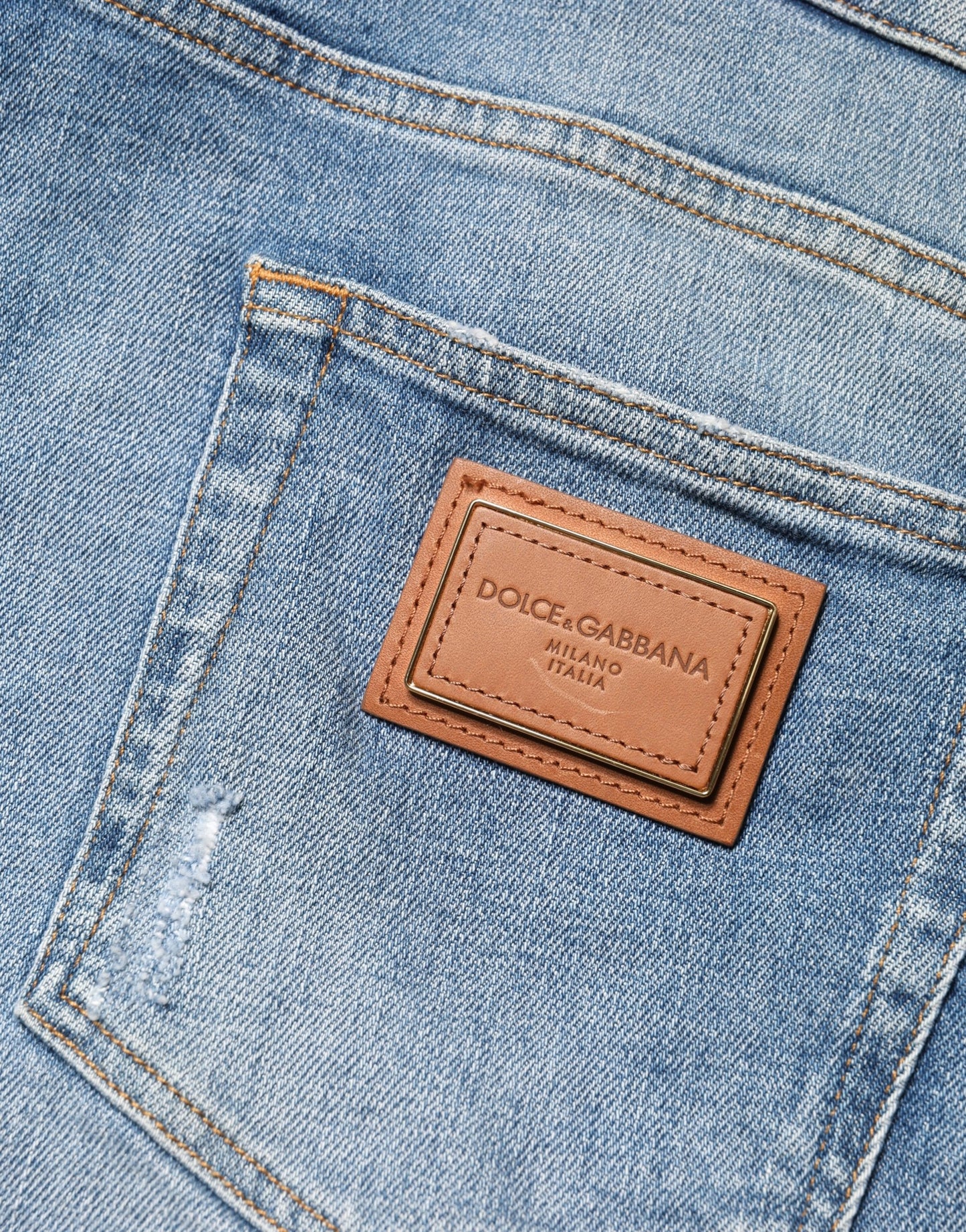 Dolce & Gabbana Vaqueros de hombre de denim de algodón azul rotos, corte ajustado