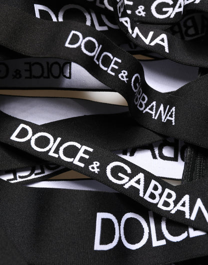 Pantalon Dolce & Gabbana taille haute skinny noir avec découpes et logo en ruban