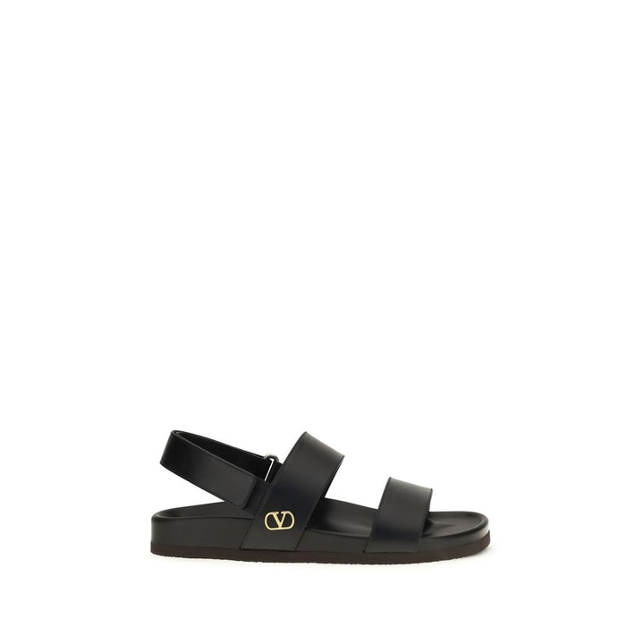 Valentino Garavani Sandales plates en cuir de veau noir Bos Taurus