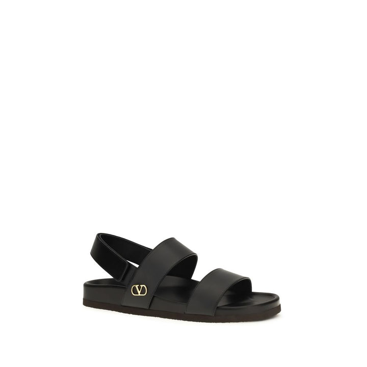 Valentino Garavani Sandales plates en cuir de veau noir Bos Taurus