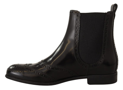 Chaussures bottes plates montantes Dolce & Gabbana en cuir noir