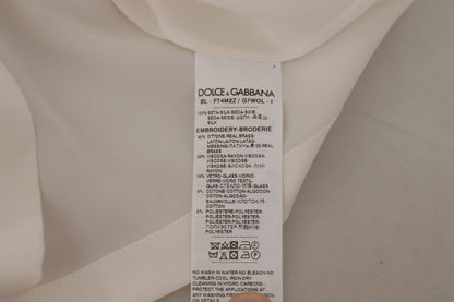 Chemisier Dolce & Gabbana en soie blanche avec cristaux DG dorés