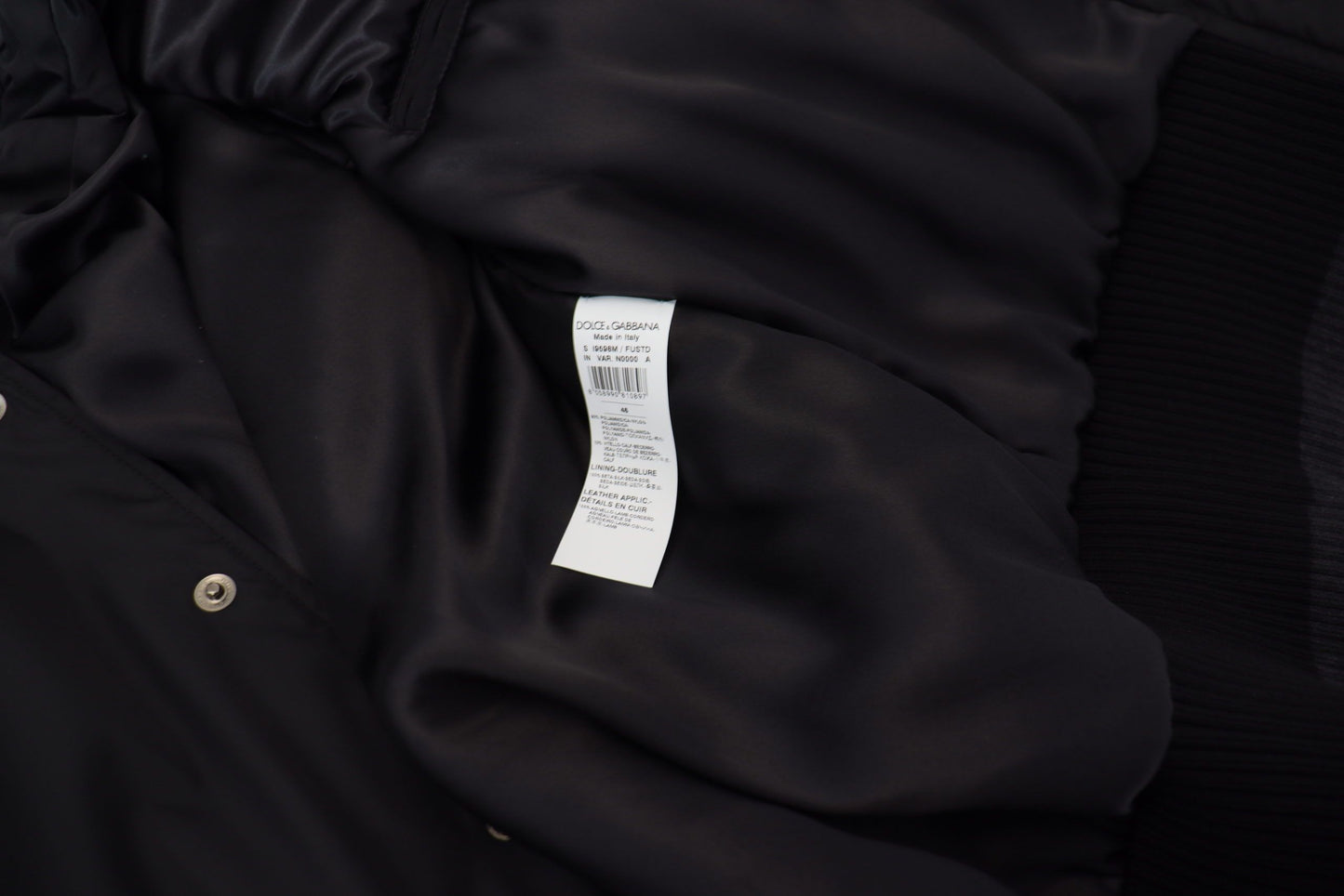 Dolce & Gabbana Chaqueta de nailon negro con botones de cristales