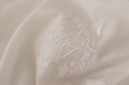 Chemisier Dolce & Gabbana en soie blanche à manches longues brodé logo DG