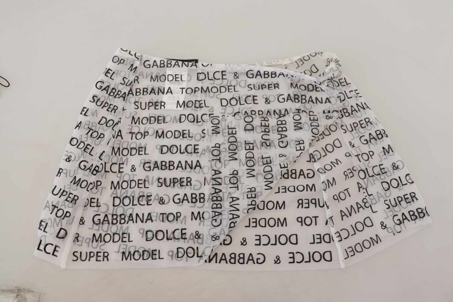 Mini-jupe évasée transparente à logo blanc Dolce & Gabbana