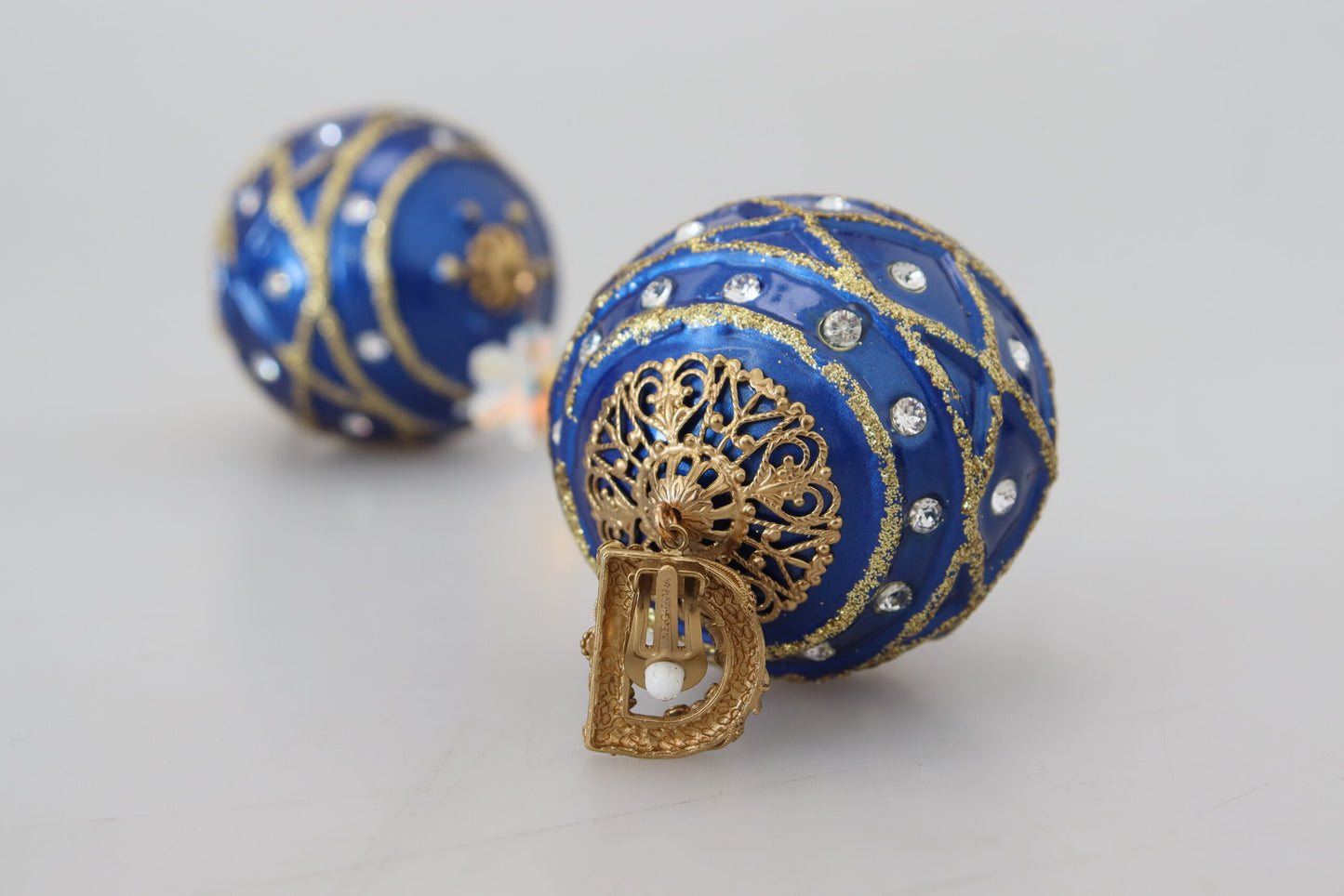 Boucles d'oreilles clips Dolce & Gabbana en laiton doré avec boule pendante bleue et cristaux
