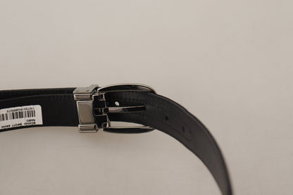 Ceinture Dolce & Gabbana en cuir de veau noir, avec boucle ardillon en métal argenté ornée du logo.