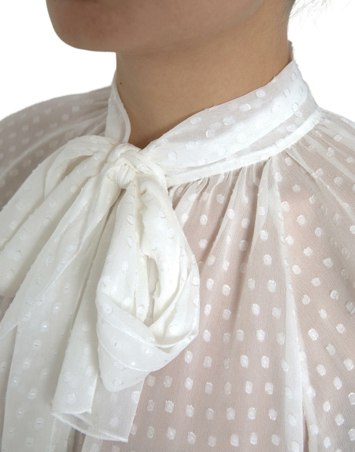 Blusa blanca de seda transparente con cuello anudado y lunares de Dolce & Gabbana