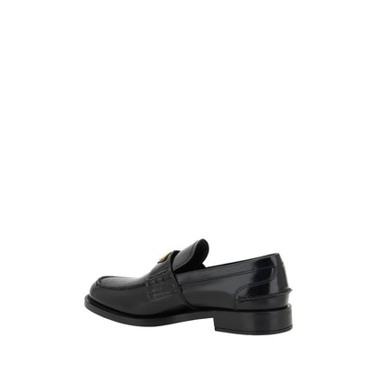 Mocassins Prada en cuir noir avec logo