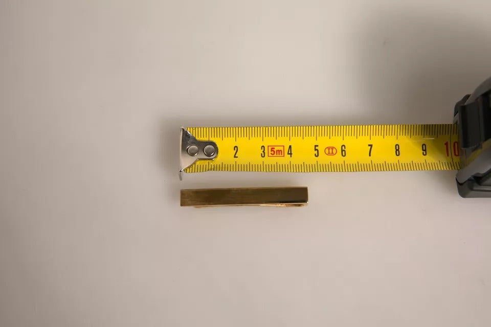 Barra de pasador de corbata con logo de latón dorado de Dolce & Gabbana