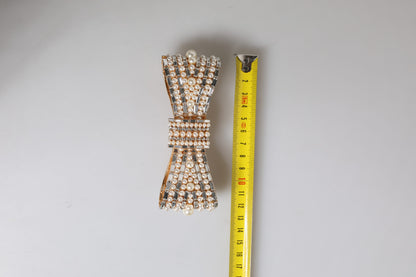 Broche Dolce & Gabbana en laiton doré avec nœud, cristaux et fausses perles