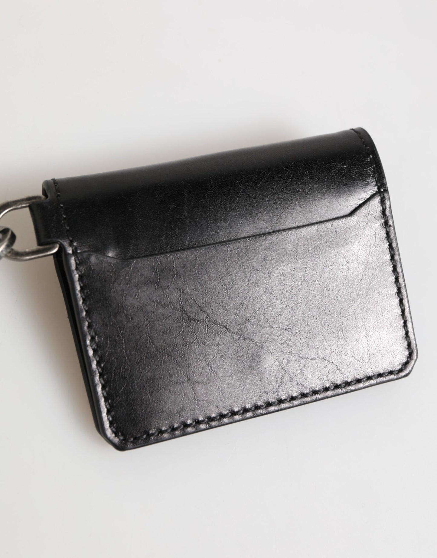 Cartera Dolce & Gabbana de piel negra con logo grabado y tarjetero con llavero